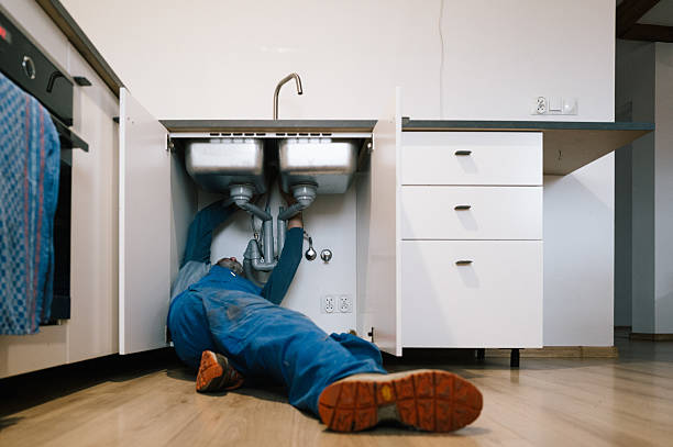 Professional Emergency Plumber technician working in Wildwood, GA